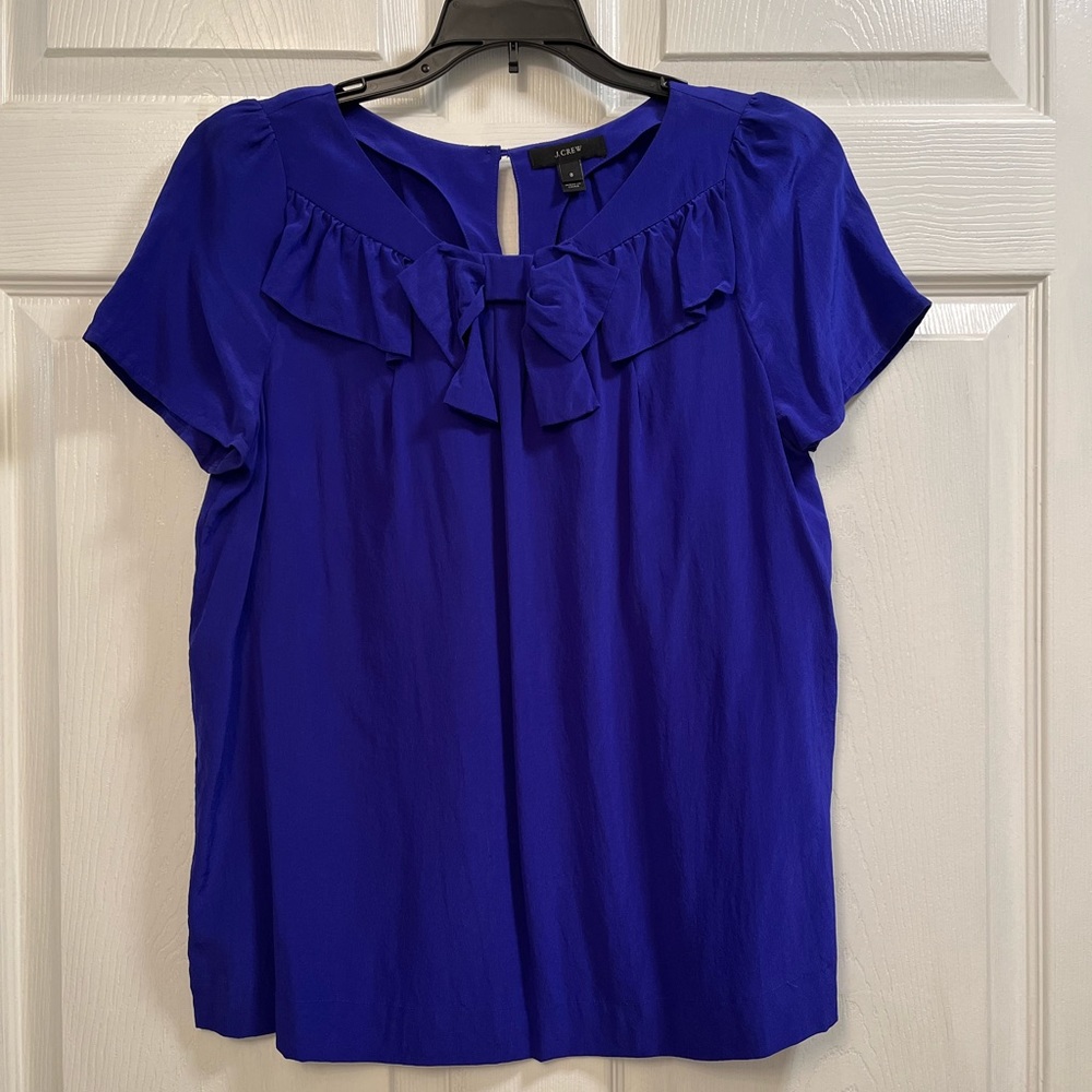 Jcrew top blouse size 8 blue color 100% silk bow detail in the front
